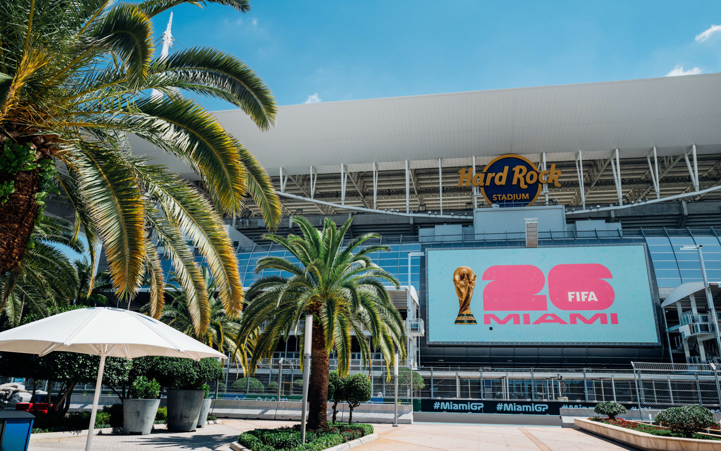 Miami stadium with neon lights and cheering crowd